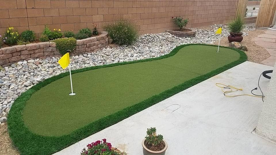 Small turf putting green in Albuquerque backyard